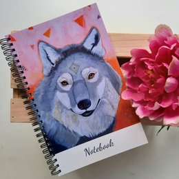 notesbog med ulvetegning